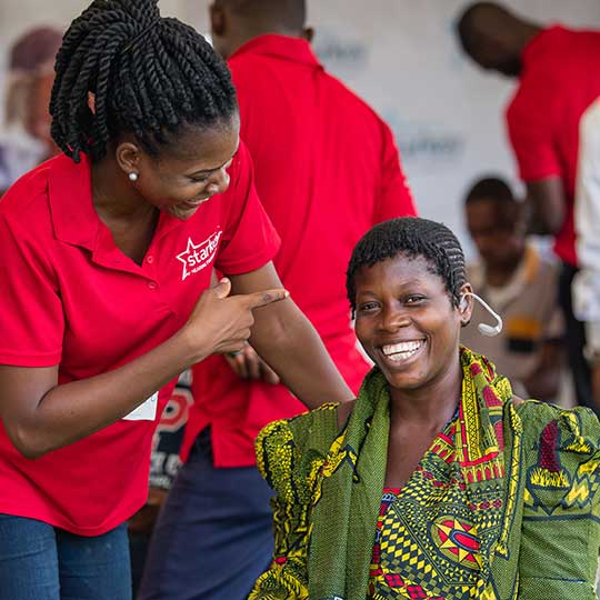 woman getting her hearing aid